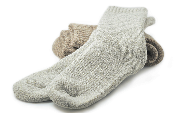 grey sheep wool socks isolated on a white background